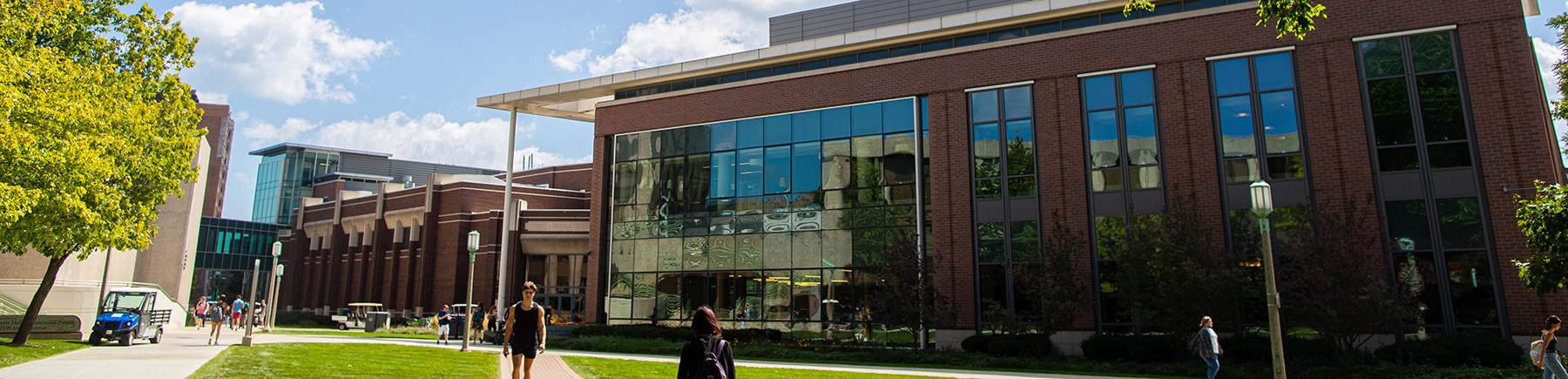 Students walk through the courtyard outside of the north entrance of Damen Stude