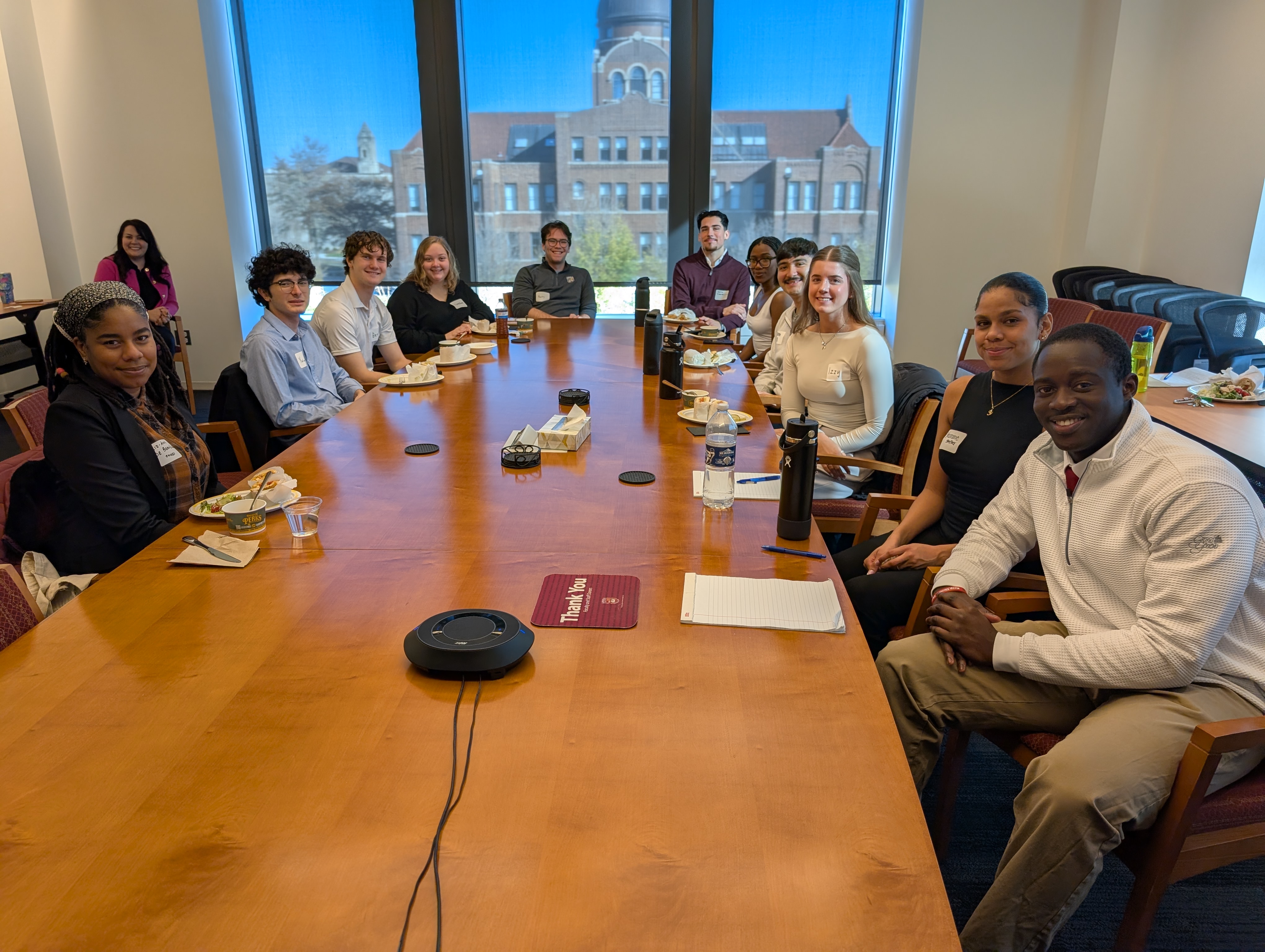 students at table in conference room 