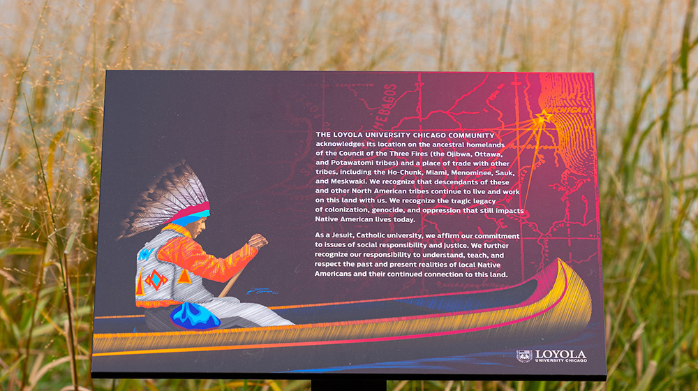 Land Acknowledgement Statement sign near the lake shore
