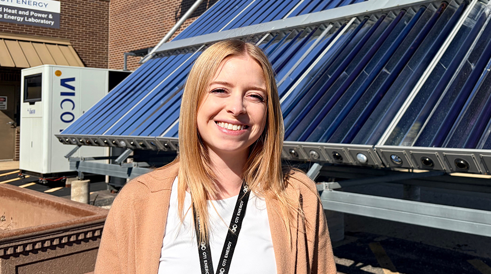 Haley Lim in front of a solar panel