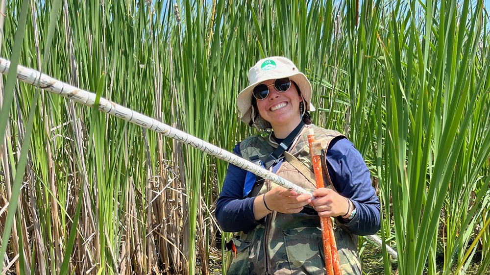 MacKenzie Michaels in a wetland