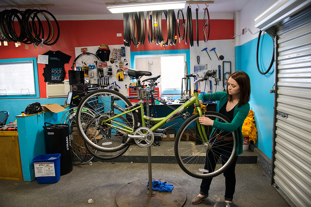 A student at Chainlinks, Loyola's on-campus bike shop. 