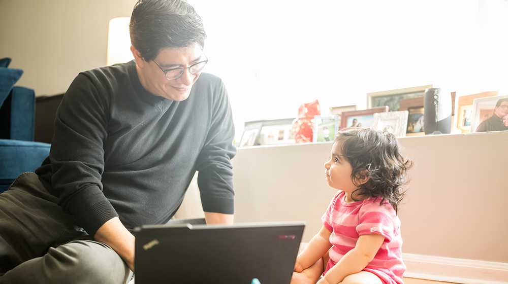 Adrian De La Cruz is among the many working parents who have found a way to make a Loyola degree achievable while juggling a full-time job and caring for children. (Photo: Lukas Keapproth)