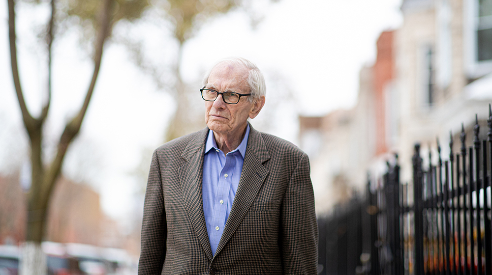 Jack McNamara, a visiting scholar in Loyola's Center for Urban Research and Learning, stands on Flournoy Street in North Lawndale. For decades, McNamara fought against the exploitive sales of homes to Black Chicagoans through usurious contract selling.  (Photo: Lukas Keapproth)