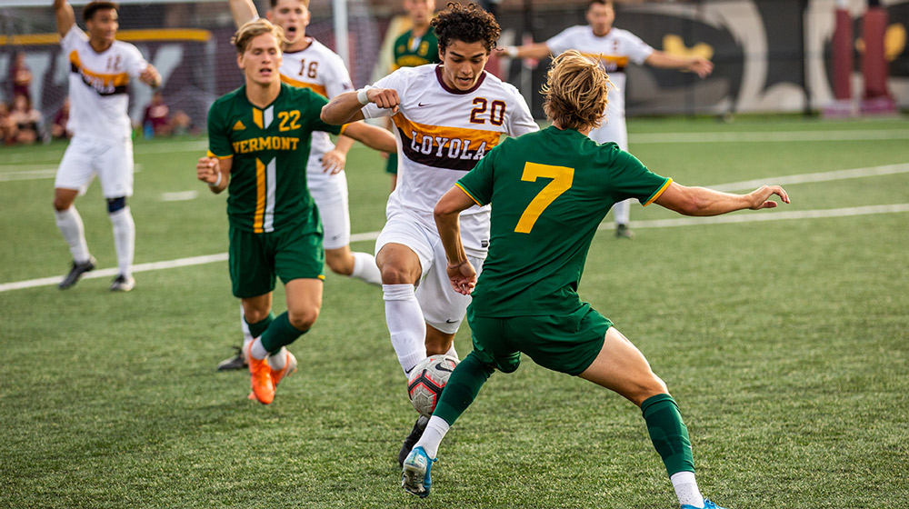 The men’s soccer team, shown taking on Vermont in a game the Ramblers won 2-1, capped a thrilling season with an MVC Conference Tournament victory over Missouri State. (Photo: Mary Grace Ritter)