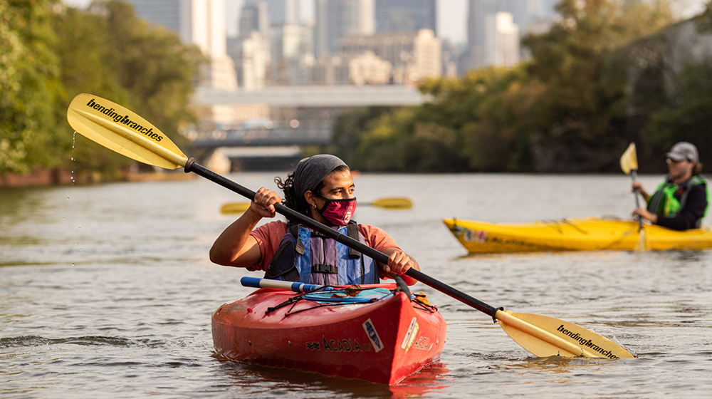 Students at Loyola University Chicago haven't only been in the classroom this fall. Some, like graduate student Raul Lazcano, have thrown on masks and hopped into kayaks to study trash and other debris polluting the Chicago River. (Photo: Lukas Keapproth)