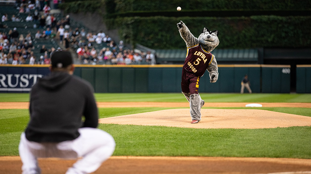 Lu Wolf throws out the first pitch at the Chicago White Sox Loyola Night game at Guaranteed Rate Field on September 6.