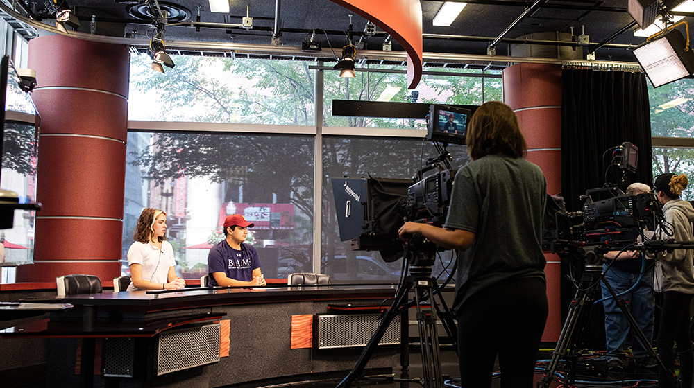 Loyola students receive hands-on instruction in Lee Hood's Newscasting and Producing course held in the School of Communication's broadcast classroom on the Water Tower Campus.
