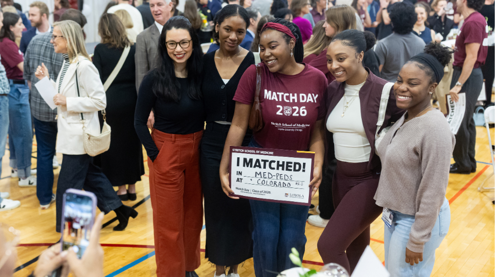 Phaedra Johnson with four women posing with her at Match Day Phaedra Johnson with four women posing with her at Match Day
