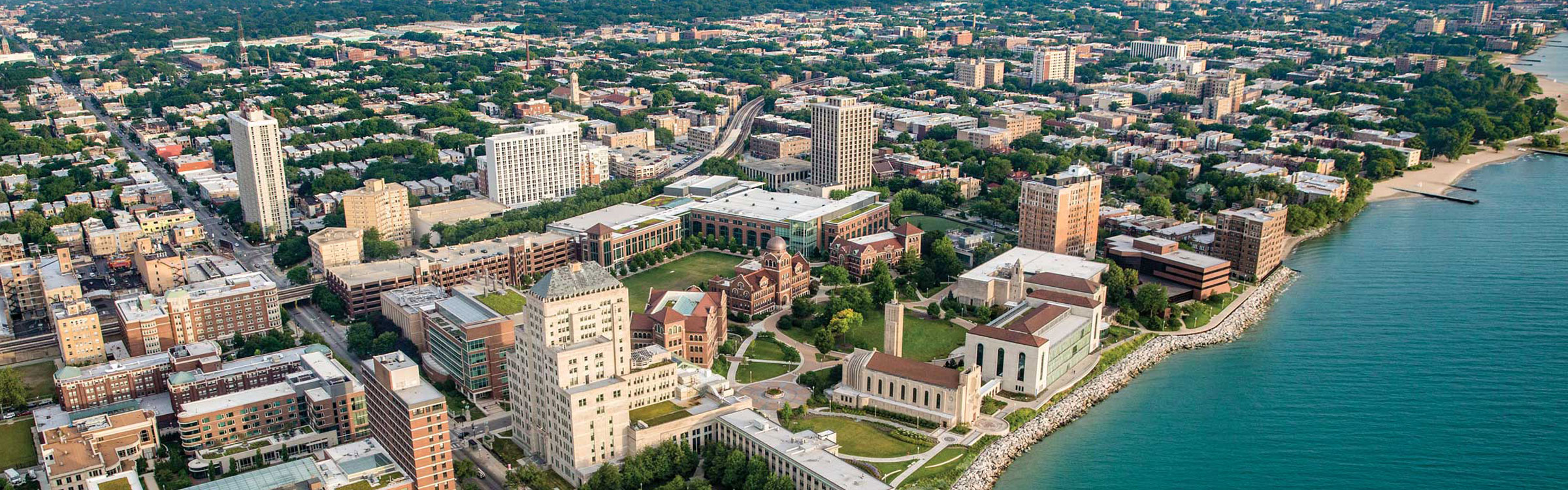 An aerial perspective of Loyola University Chicago's Lake Shore Campus from a southeast vantage point